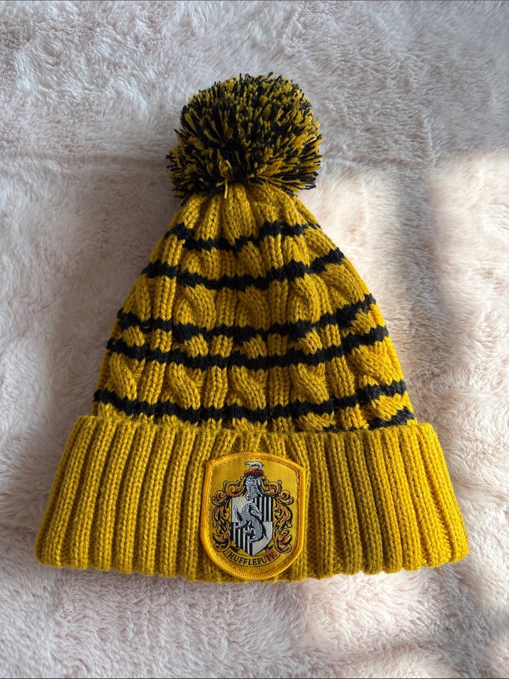 Yellow and Black Striped Pom Pom Beanie Hat with Crest Patch